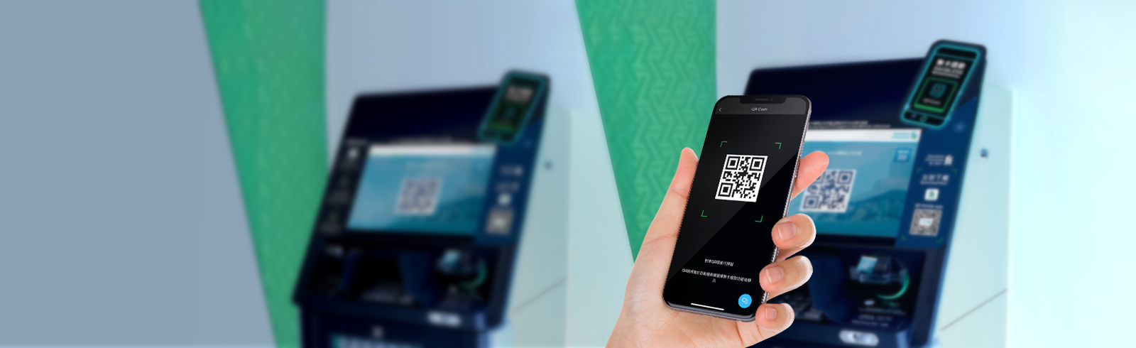 a hand holding a phone, scanning the QR Cash code on the screen of an ATM machine
