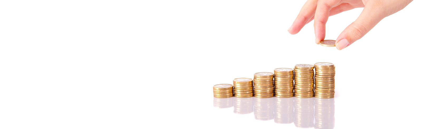 a hand holding a coin to create a higher stack of coins