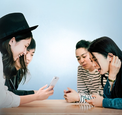 A group of friends are learning how to use SC Pay