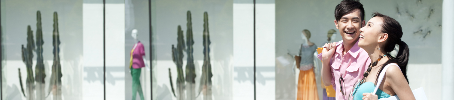 couple shopping happily in a mall