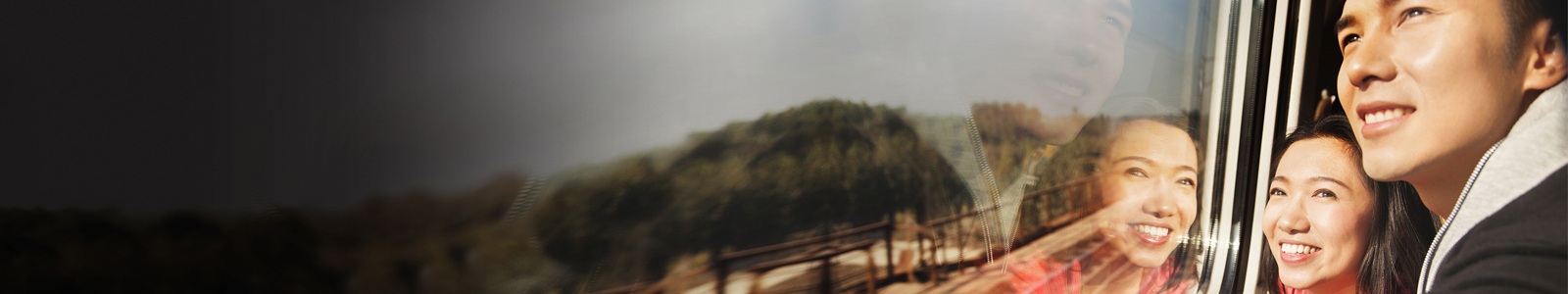 Chinese couple looking out train window